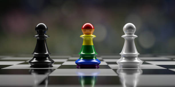 istock Rainbow color Chess pawn among black and white pawn on chessboard, Inclusion and diversity 1566492186