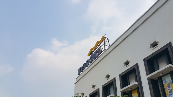 Jakarta, Indonesia - July 22, 2023: Bank Mandiri logo on top of the building at Kota Tua Jakarta