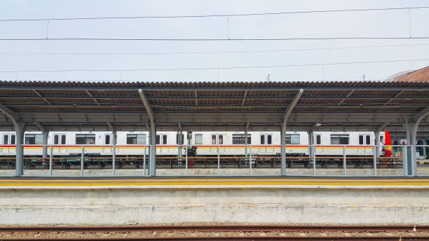 istock The trains stop at the station. An empty train platform. 1566495870