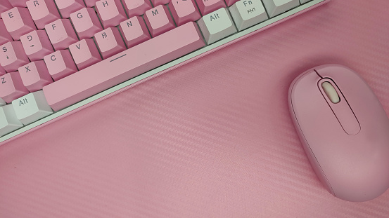 Eye-catching pink background and the presence of a keyboard and mouse device, this image is a symbol of harmony between attractive aesthetics and high functionality in the world of technology