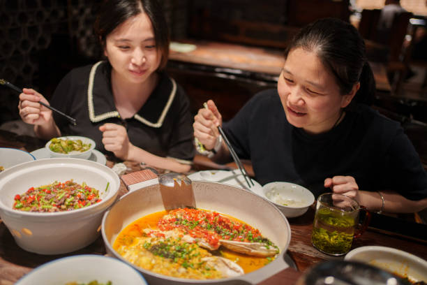 istock A pair of women enjoying dinner 1566534161