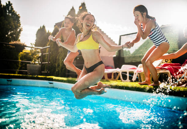 istock multi generation family enjoying at pool  party at home 1566566604