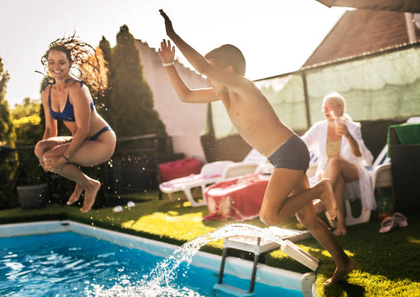 istock multi generation family enjoying at pool  party at home 1566570301