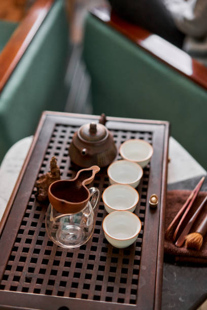 istock Brewing white tea in a transparent teapot. Everything is ready for the tea ceremony. The ceremony is according to all the rules, but not in the classical style. Adapted to a modern apartment. 1566574466