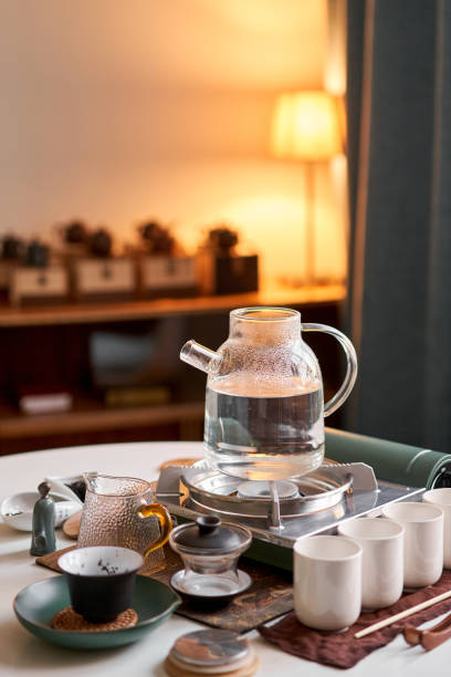 istock Brewing white tea in a transparent teapot. Everything is ready for the tea ceremony. The ceremony is according to all the rules, but not in the classical style. Adapted to a modern apartment. 1566575120
