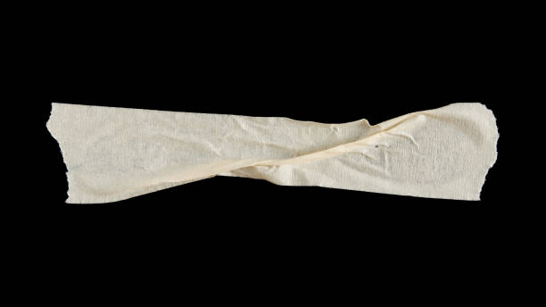 istock adhesive paper , masking tape isolated on black background 1566575154