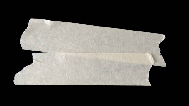 istock adhesive paper , masking tape isolated on black background 1566575201