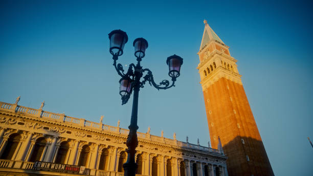 Street lamp by Campanile tower at St. Mark's square