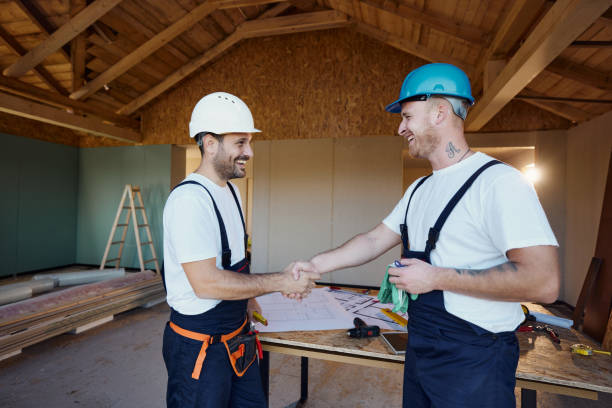 istock Happy workers came to a successful agreement at construction site. 1566597461