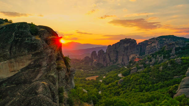 istock Meteora rock formations and lush green landscape 1566600954