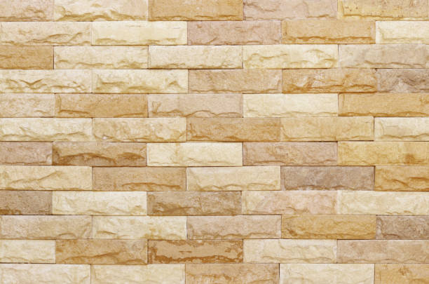 istock Sandstone brick wall texture with vintage style for background and design art work. 1566604206