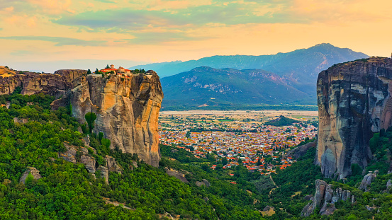 Beautiful Meteora monasteries and cityscape against mountain at Thessaly,Greece