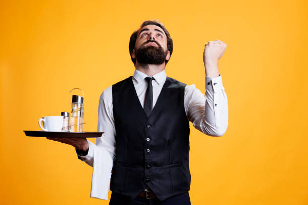 istock Waiter praying to god for success 1566611171