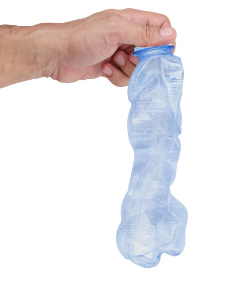 istock Hand hold compressed plastic bottle isolated on white background with clipping path 1566621343