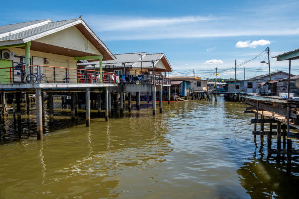 istock Buildings on stilts over a jungle river 1566622390
