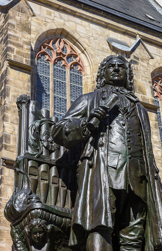 Statue of composer Johann Sebastian Bach with organ in Leipzig, Germany