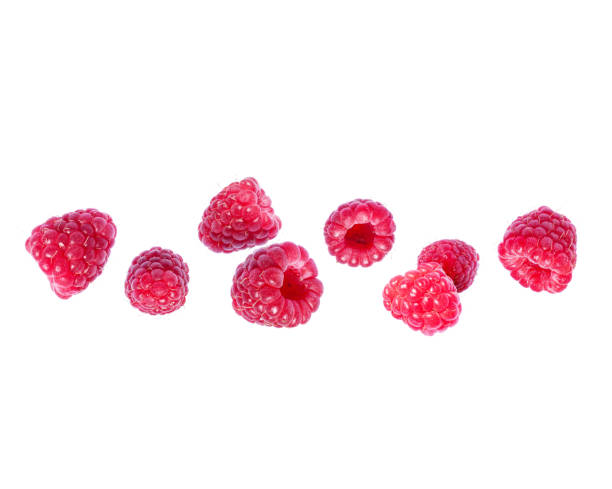 ripe juicy raspberries close up in the air on a white background - falling fruit berry fruit raspberry imagens e fotografias de stock