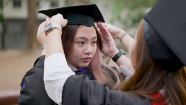 College students wearing mortarboard on graduation day