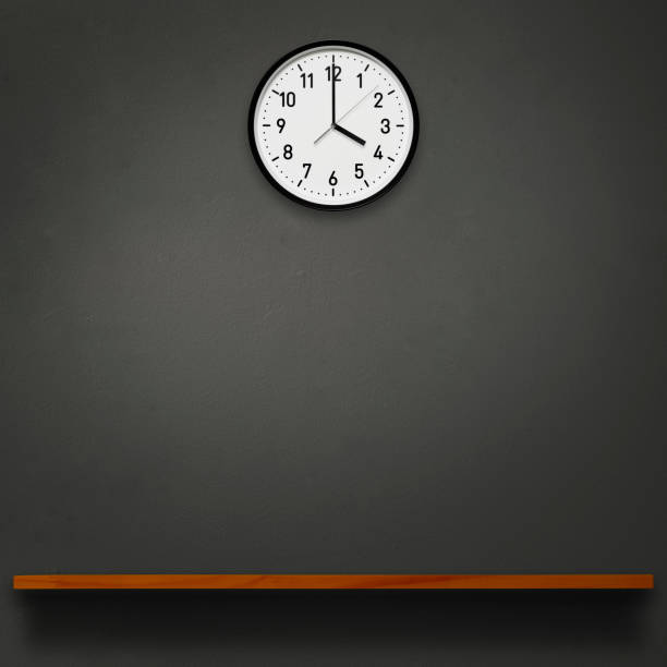 istock 4 O'Clock wall clock above the wooden shelf 1566699369