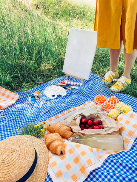 istock Illustrating scenes during a delightful park picnic. 1566702122