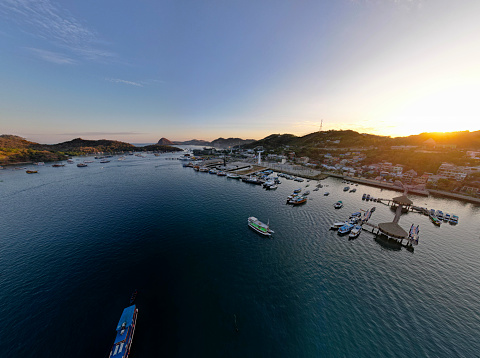 Labuan Bajo port - Rush Hour view in Labuan Bajo Harbour in the morning with Luxury Phinisi view Sailing Komodo National Park