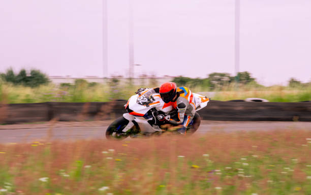 Free Stock Photo of Group of Motorcyclists Racing Around a Track ...