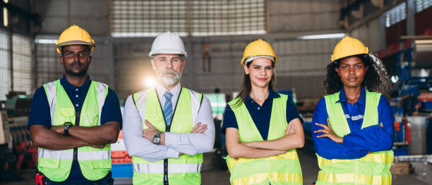istock Team engineers and foreman stack hand and shake hands to show success at factory machines. Worker industry join hand for collaboration. 1566738467
