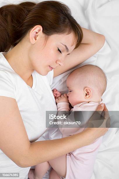 Young Mother And Her Baby Sleeping Together Stock Photo - Download Image Now - 6-11 Months, Adult, Baby - Human Age