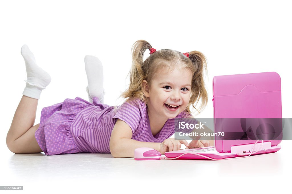 child girl playing with laptop toy happy child girl playing with laptop toy Cheerful Stock Photo