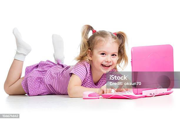 Child Girl Playing With Laptop Toy Stock Photo - Download Image Now - Cheerful, Child, Child Prodigy
