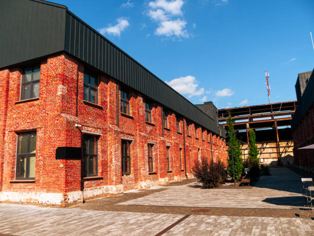 istock Modern cafe workspace exterior loft style red brick wall Old industrial buildings renovation Urban space Break-out areas 1566749272