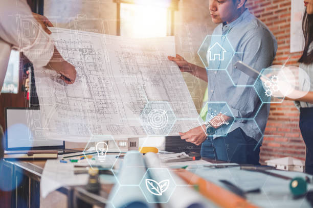 istock engineers and team check blueprint for construction process guided by smart home hud dashboard. 1566757507