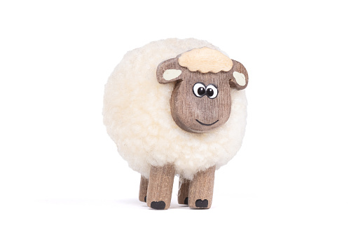 Miniature sheep, funny figurine, isolated on white background