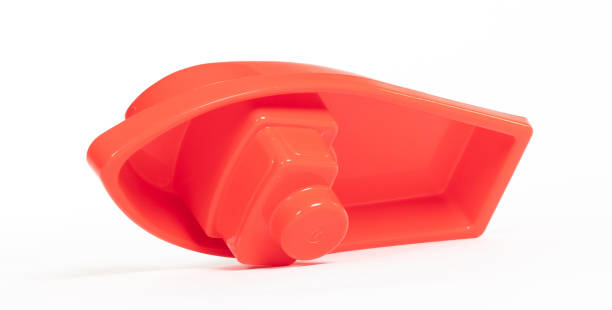 istock Plastic toy boat isolated on white 1566769845