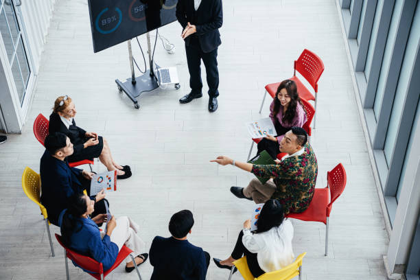 istock Serious asian businessman discusses ideas 1566771496