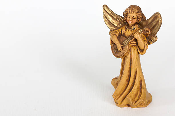 istock Smiling angel playing guitar 156679023