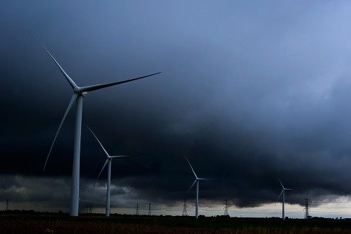 wind turbines, stormy and dark weather at the windfarm