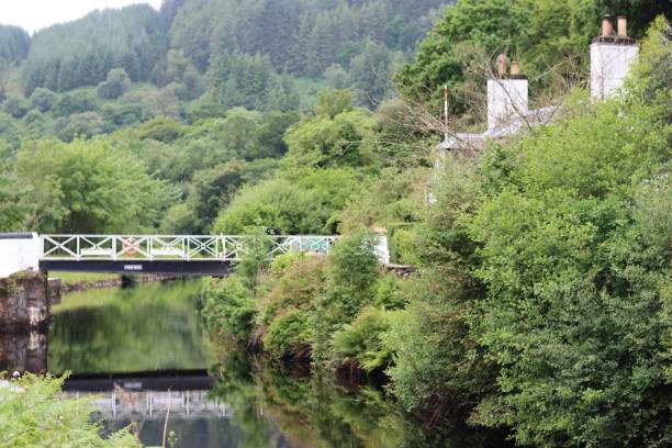 istock View along a canal to a lock keepers cottage and old bridge 1566802051
