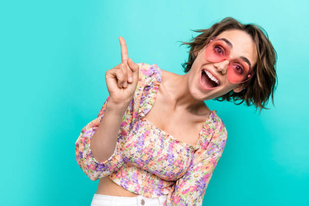 istock Portrait of impressed nice person open mouth indicate finger empty space ad isolated on turquoise color background 1566809096
