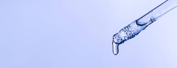 istock serum pipette close-up with falling drop 1566813080