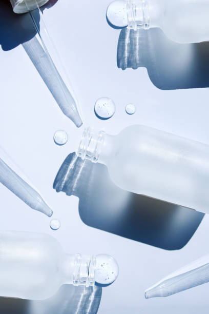 istock pipette drop of serum test on gray background 1566815280