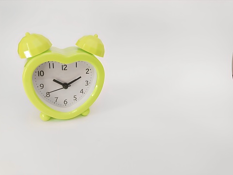 A cute bell clock in green.