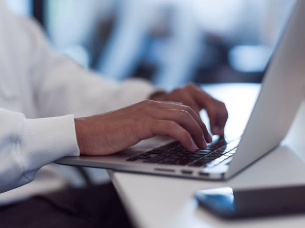 istock In a modern office setting, an African American businessman is diligently working on his laptop, embodying determination, ambition, and productivity in his professional environmen 1566821255