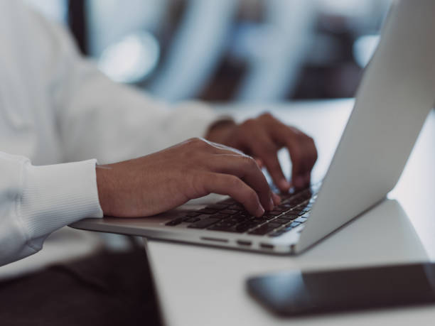istock In a modern office setting, an African American businessman is diligently working on his laptop, embodying determination, ambition, and productivity in his professional environmen 1566822915