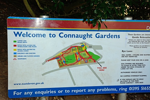 Welcome to Connaught Gardens sign with a plan of the site, Sidmouth, Devon, UK, Europe.