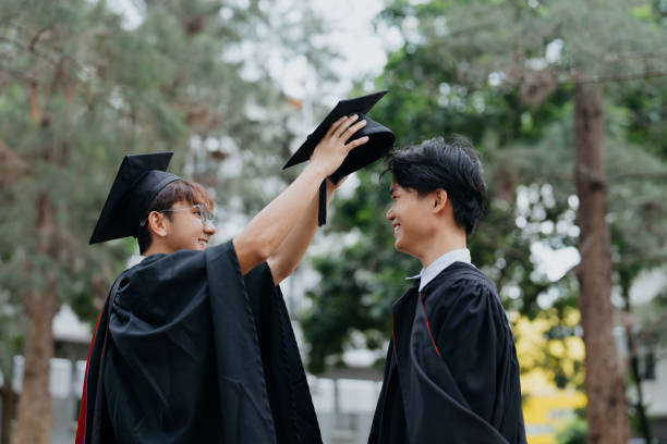 istock Asian college student getting ready for graduation ceremony 1566846735