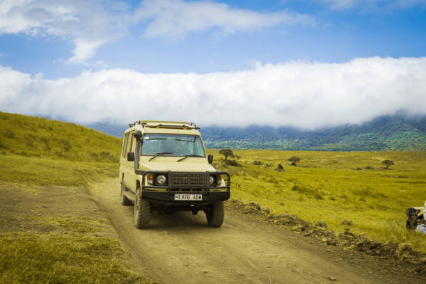 Ngorongoro Crater, Arusha, Tanzania - 21 June 2023- Safari Jeep on a trail in a conservation area
