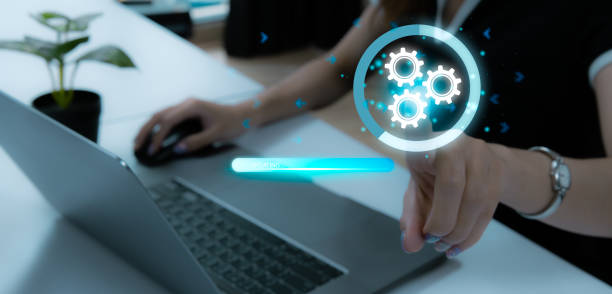 istock Robotic Process Automation technology to automate business tasks with AI. Expert setting up automated software on laptop computer. Digital transformation and change management. 1566857006