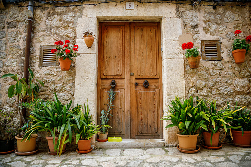 Beautiful cozy and flower-adorned entrance to a typical house in Valldemossa, Mallorca, Spain