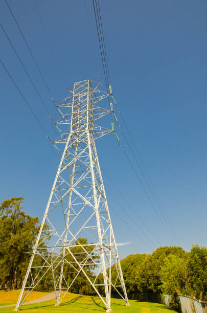 istock High Voltage Overhead power line standing against blue sky day. 1566858737